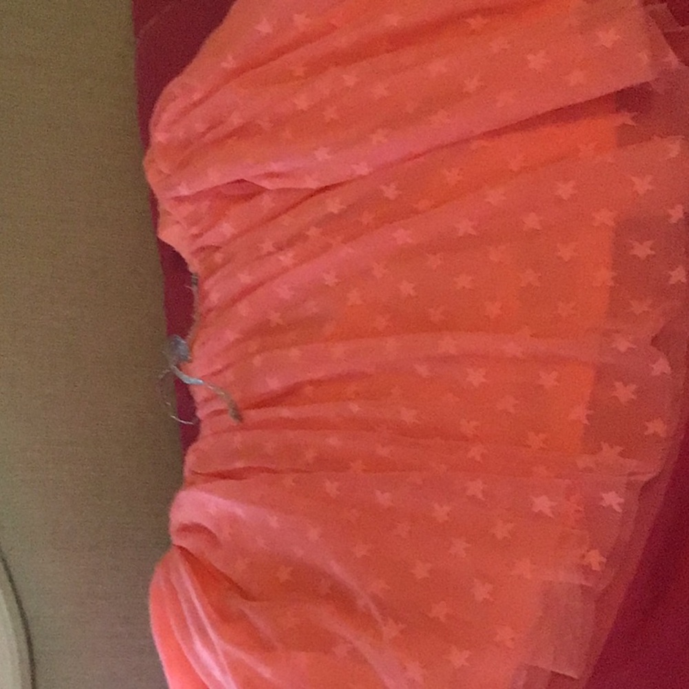 Youth 10-12 coral star loose skirt.